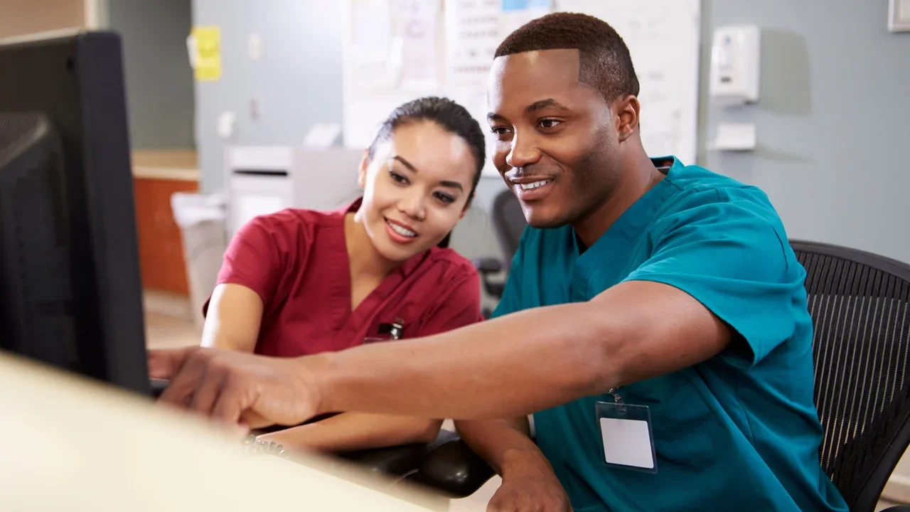 Two nurses on computer