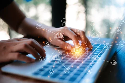 Person typing on laptop keyboard