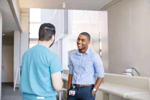 IT staffer talks to a medical student