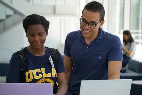 IT staff helping students