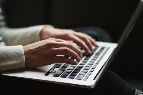 Stock image of person on computer