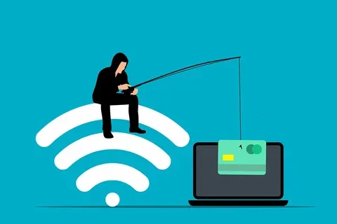 Man sitting on the WiFi signal phishing for account information on a laptop
