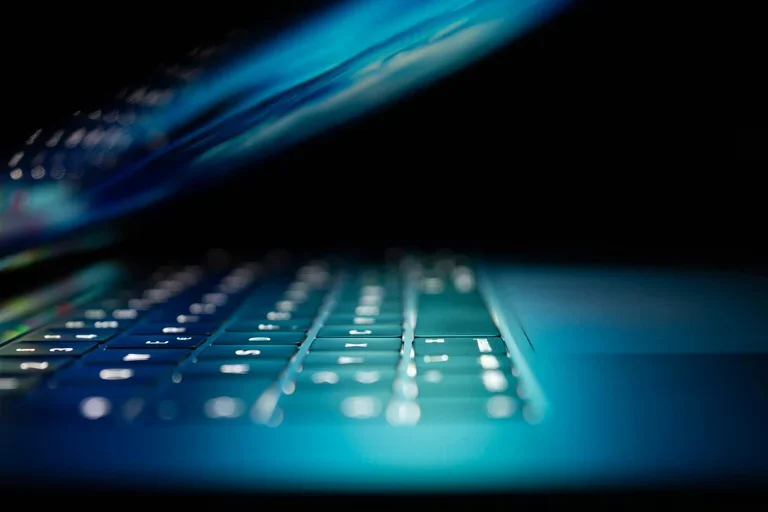 Illuminated half open laptop