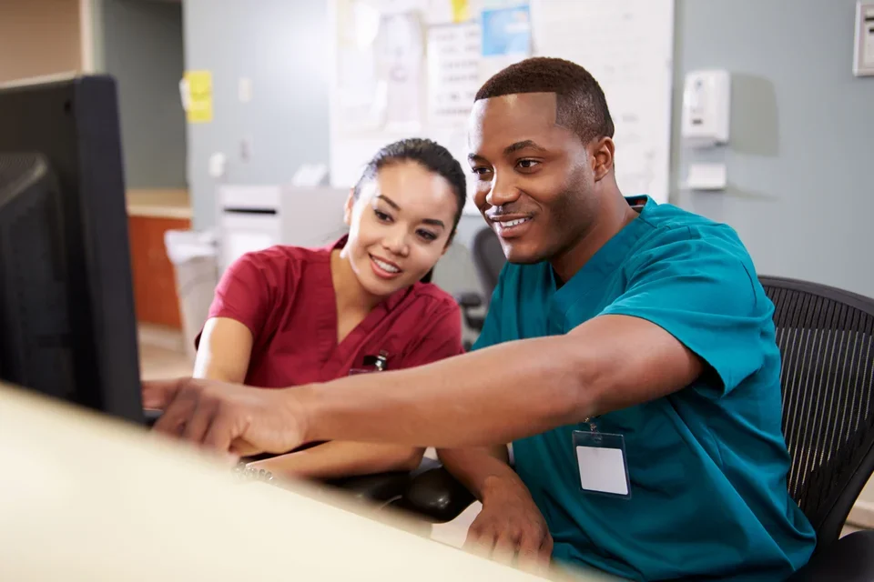Two nurses on computer