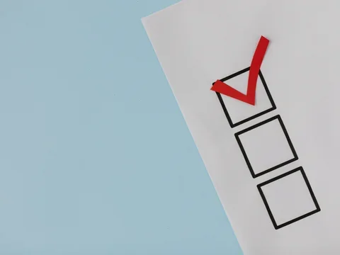 A simple white paper checklist with one red checkmark