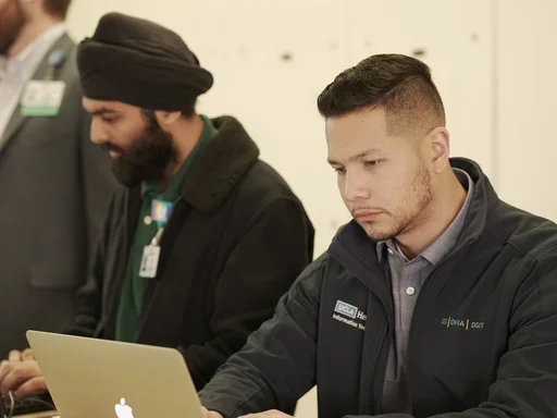 IT techs working on their laptops