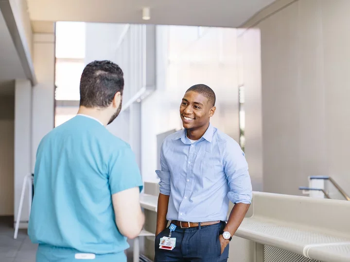 IT staffer talks to a medical student