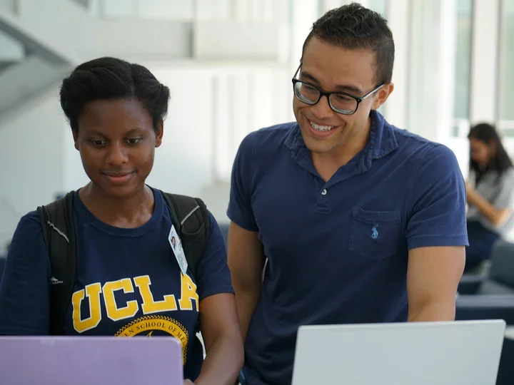 IT staff helping students