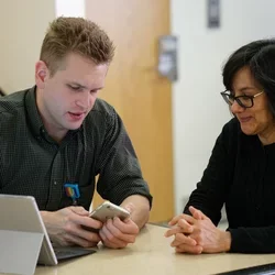 Image of technician supporting staff