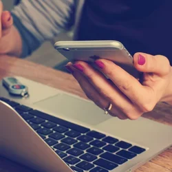 Image of woman holding a phone