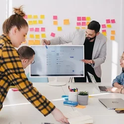 A team looking at a project together