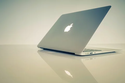 Macbook sitting on a table