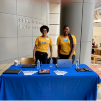 UHIT staff in front of a table at the Ask me about myUCLAhealth event. 