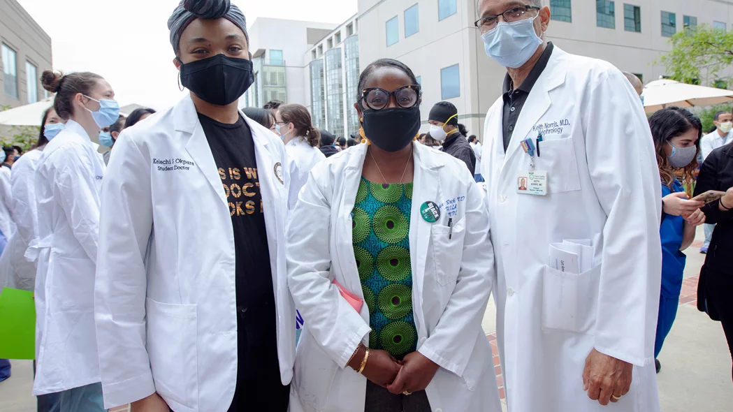 A black medical student with two black doctors at the 2020 Solidarity Day